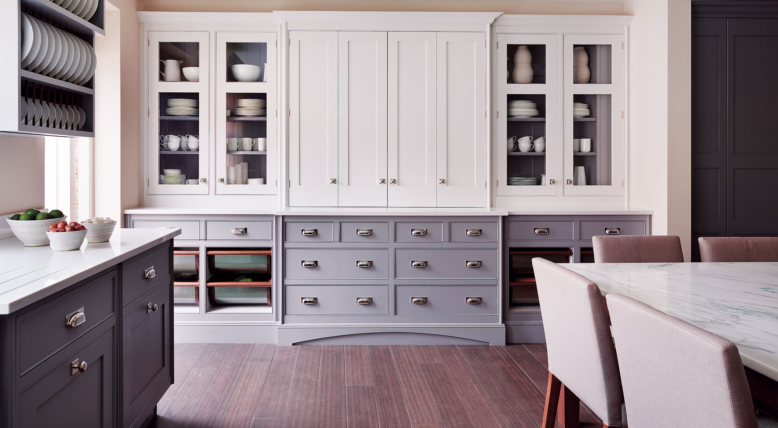 a Smallbone Iconic kitchen with upper cabinetry painted in white and lower cabinetry hand finished in grey