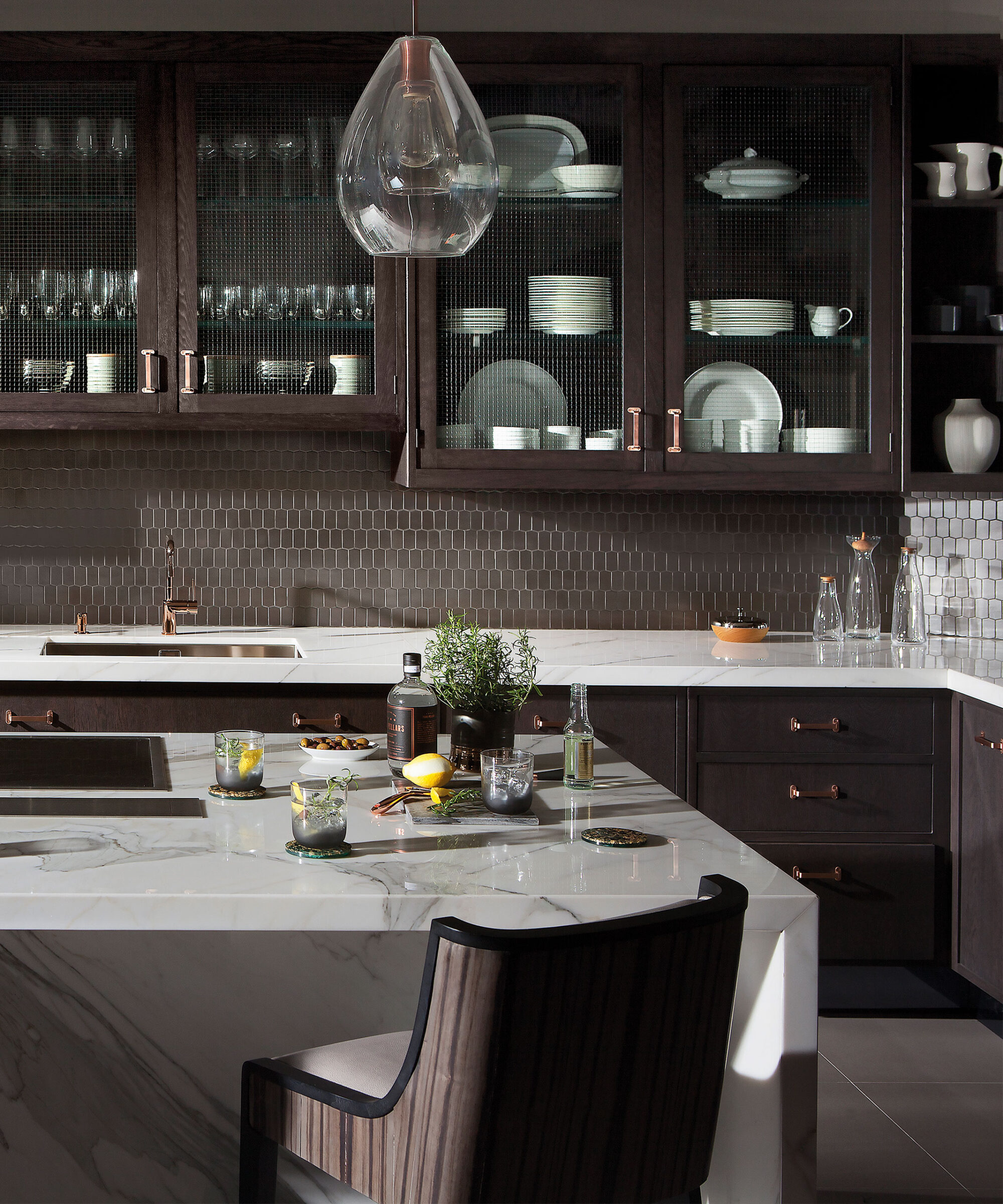 a Smallbone Mulberry kitchen with a dark grey stain and georgian wire glass fronted cabinets