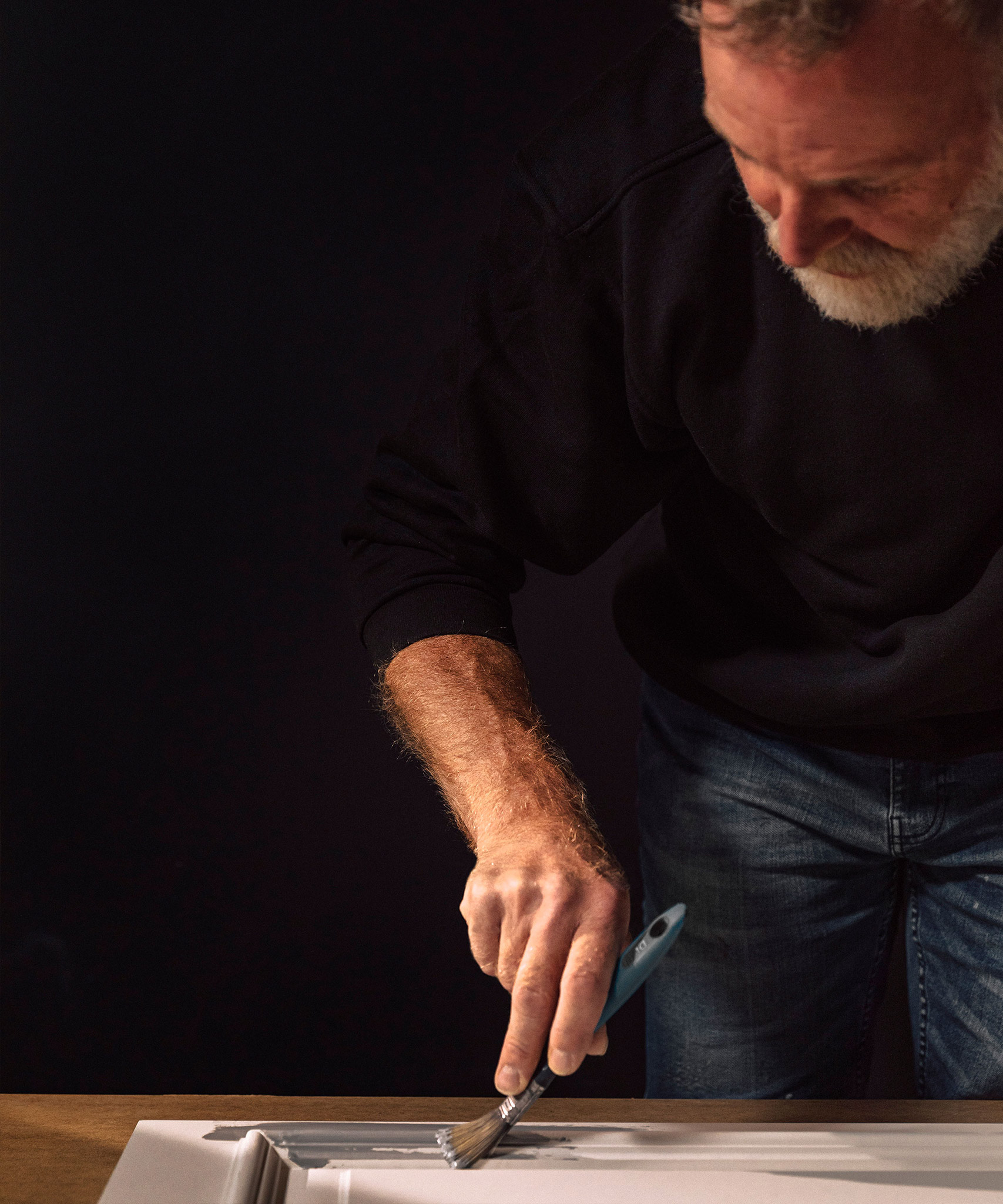 A Smallbone craftsman painting cabintery